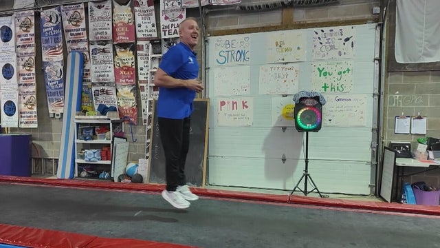 Bill Roth jumps on a trampoline at his gym in Delaware County 