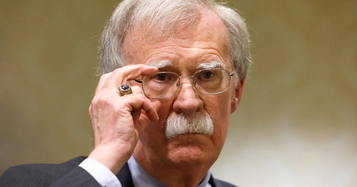What are the charges against John Bolton?