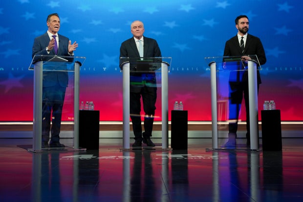 Independent candidate former New York Gov. Andrew Cuomo, left, speaks during a mayoral debate with Republican candidate Curtis Sliwa, center, and Democratic candidate Zohran Mamdani, Thursday, Oct. 16, 2025, in New York. 