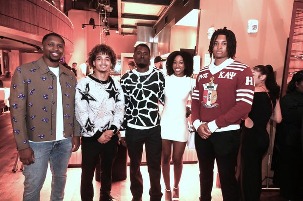 People post for a photo at the opening of Kitchen + Kocktails, a restaurant in Philadelphia