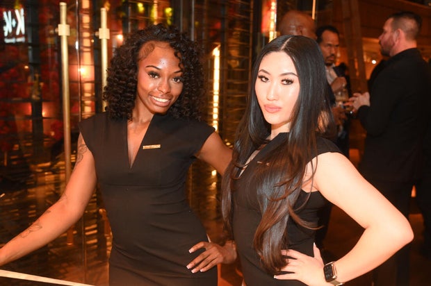 People post for a photo at the opening of Kitchen + Kocktails, a restaurant in Philadelphia