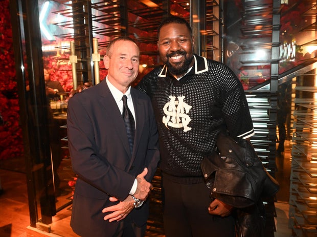 People post for a photo at the opening of Kitchen + Kocktails, a restaurant in Philadelphia