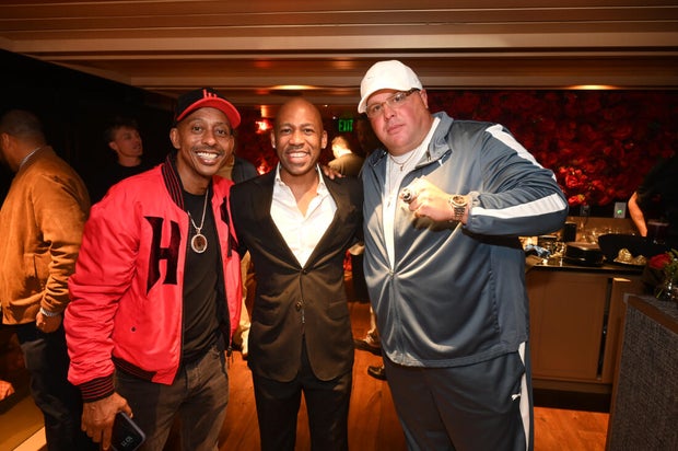 People post for a photo at the opening of Kitchen + Kocktails, a restaurant in Philadelphia