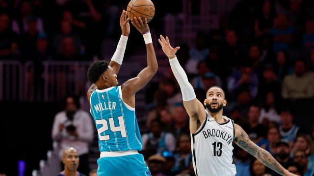 Charlotte Hornets forward Brandon Miller (24) shoots over Brooklyn Nets forward Tyrese Martin (13) during the second half of an NBA basketball game in Charlotte, N.C., Wednesday, Oct. 22, 2025. 