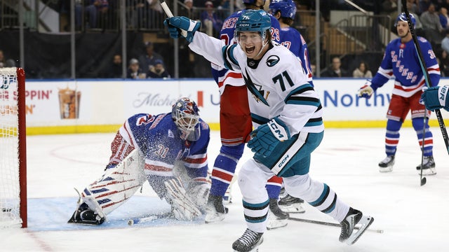 Macklin Celebrini #71 of the San Jose Sharks reacts after a goal scored by teammate Adam Gaudette #81 (not pictured) during the first period against the New York Rangers at Madison Square Garden on October 23, 2025 in New York City. 
