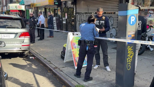 Crime scene tape blocks off sidewalk