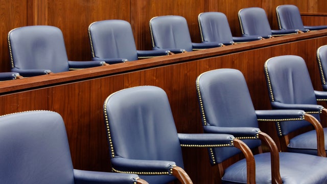 Empty Jury Seats in Courtroom