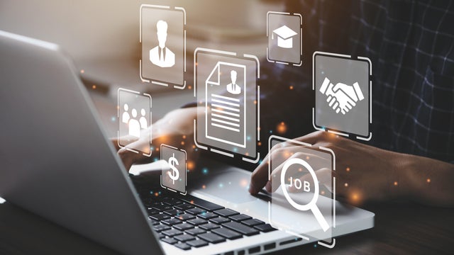 Human using a computer laptop for searching for job and fill out personal data on job website to file a resume and apply application to jobs on the internet. work search online concept.