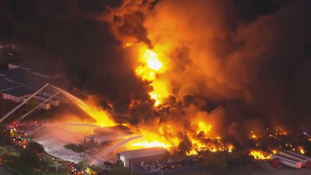 Firefighters are seen in aerial footage battling a massive blaze after a plane crash in Louisville, Kentucky, Nov. 4, 2025. 