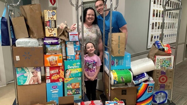 The Reim family with a pile of donations for the Ronald McDonald House in Delaware 