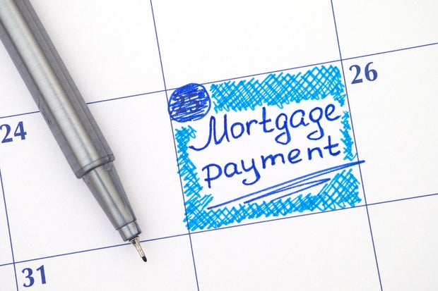 Reminder Mortgage Payment in calendar with blue pen 