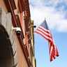 A flag flies outside the U.S. Consulate 