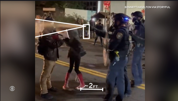 video-two-spray-at-protestor.png 