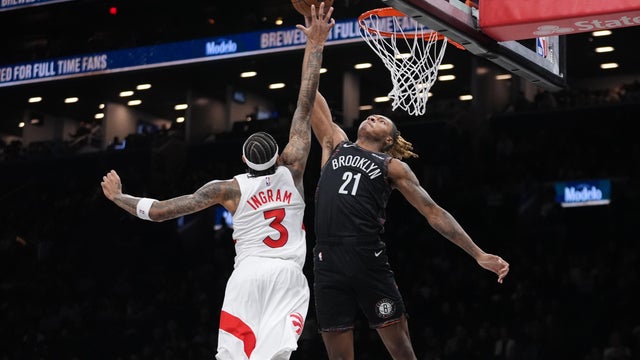 Brooklyn Nets' Noah Clowney (21) shoots over Toronto Raptors' Brandon Ingram (3) during the first half of an NBA basketball game Tuesday, Nov. 11, 2025, in New York. 