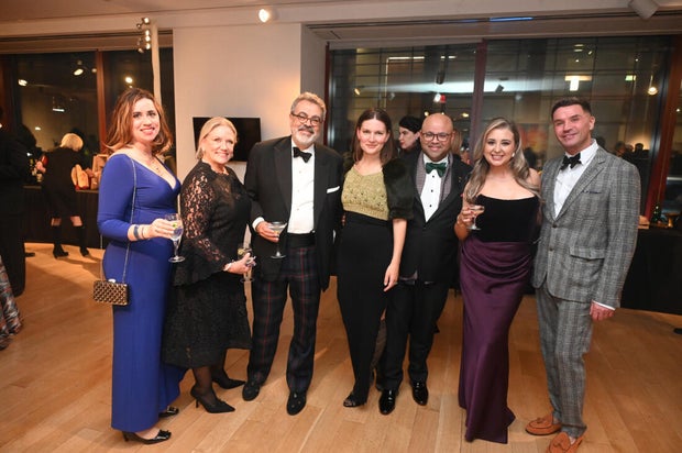 People pose for a photo at the 27th Annual Bacchanal Wine Gala and Auction 