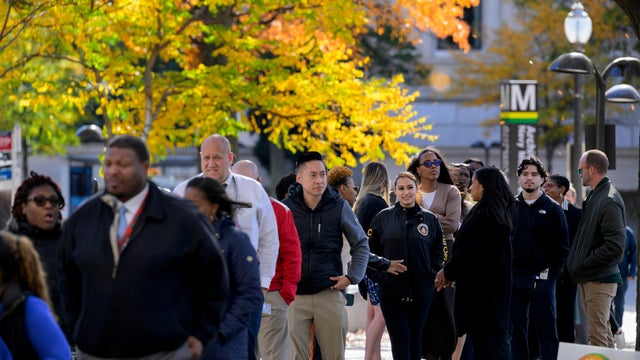 Hundreds of people wait in line as World Central Kitchen provides free meals to federal employees and their families during the government shutdown in Washington, D.C., on Wednesday, Nov. 5, 2025. 