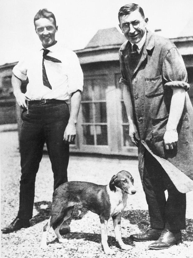 Charles Best and Frederick Banting with Dog