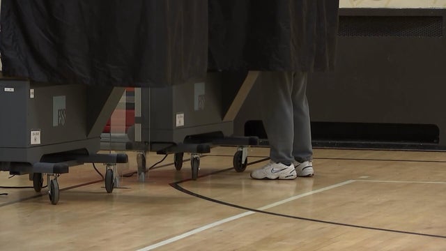 A person in a voting booth 