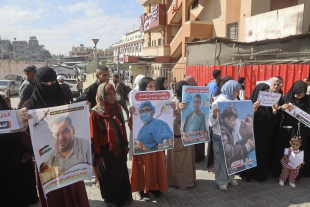 Families of detained Palestinian aesculapian  workers protestation  successful  Khan Yunis 