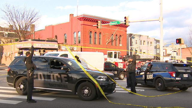 Close Up Shot Focused on Yellow Tape Showing Text Police Line Do Not Cross. Restricted Area of a Crime Scene. Bokeh Background with Flickering Siren Lights. Forensics Team Working on a Case 