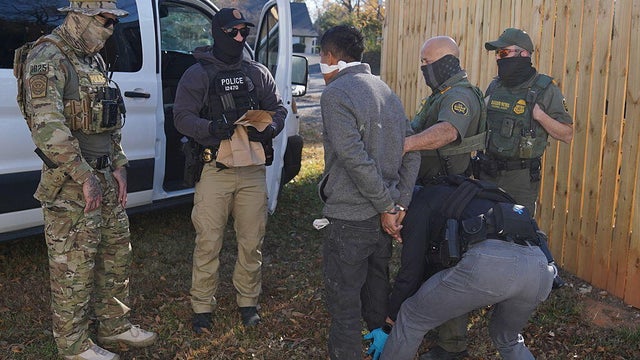 A person is detained by U.S. Border Patrol agents after being apprehended inside a fast food restaurant under construction on Nov. 19, 2025, in Charlotte, North Carolina. 
