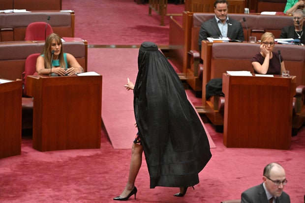 Australian far-right Senator Pauline Hanson slammed for wearing burqa to parliament to demand ban