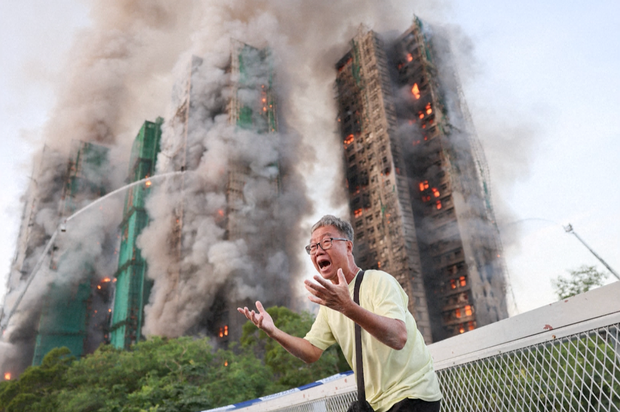 Wong, a 71-year-old man, was photographed in tears outside the burning building claiming his wife was trapped inside. 