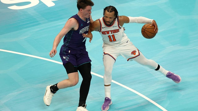 Jalen Brunson #11 of the New York Knicks dribbles against Kon Knueppel #7 of the Charlotte Hornets during the second half of the game at Spectrum Center on November 26, 2025 in Charlotte, North Carolina. 