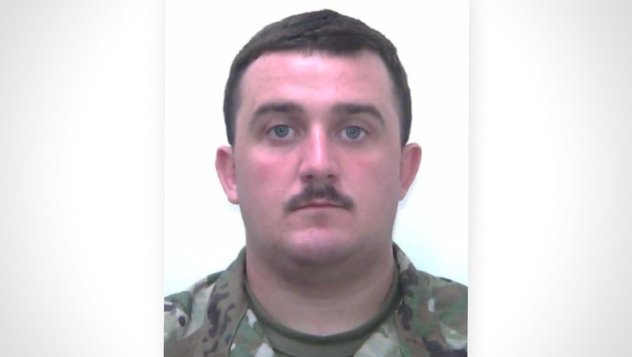 Investigators probe suspect's background in D.C. National Guard shooting