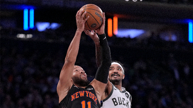 Jalen Brunson #11 of the New York Knicks heads for the net as Gary Harris #11 of the Milwaukee Bucks defends at Madison Square Garden on November 28, 2025 in New York City. 
