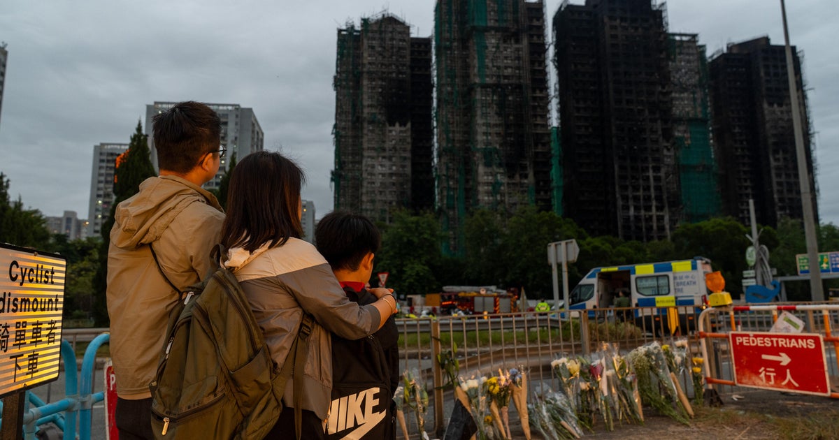 China tries to stifle anger over Hong Kong apartment fire as deaths mount