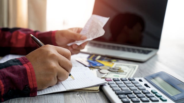 Men and documents that calculate home office expenses 