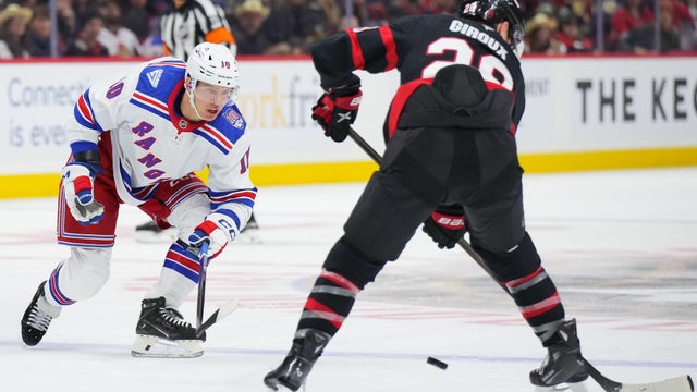 Artemi Panarin #10 of the New York Rangers forechecks against Claude Giroux #28 of the Ottawa Senators during the second period on December 4, 2025 at Canadian Tire Centre in Ottawa, Ontario, Canada. 