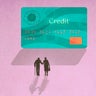 Silhouette of senior couple walking towards large credit card 