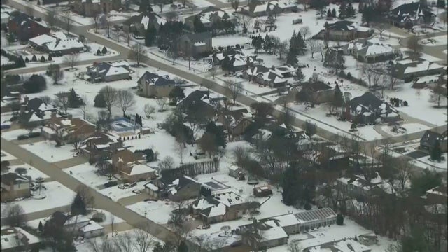Close Up Shot Focused on Yellow Tape Showing Text Police Line Do Not Cross. Restricted Area of a Crime Scene. Bokeh Background with Flickering Siren Lights. Forensics Team Working on a Case 