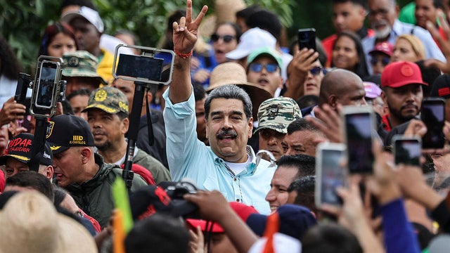President Nicolás Maduro gestures during a march commemorating the 166th anniversary of the Battle of Santa Inés in Caracas on Dec. 10, 2025. 