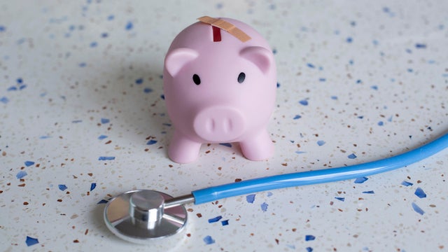 Piggy bank with band-aid 
