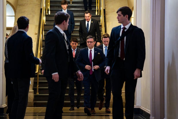 House Speaker Mike Johnson arrives for a GOP conference meeting at the U.S. Capitol on Dec. 10, 2025.