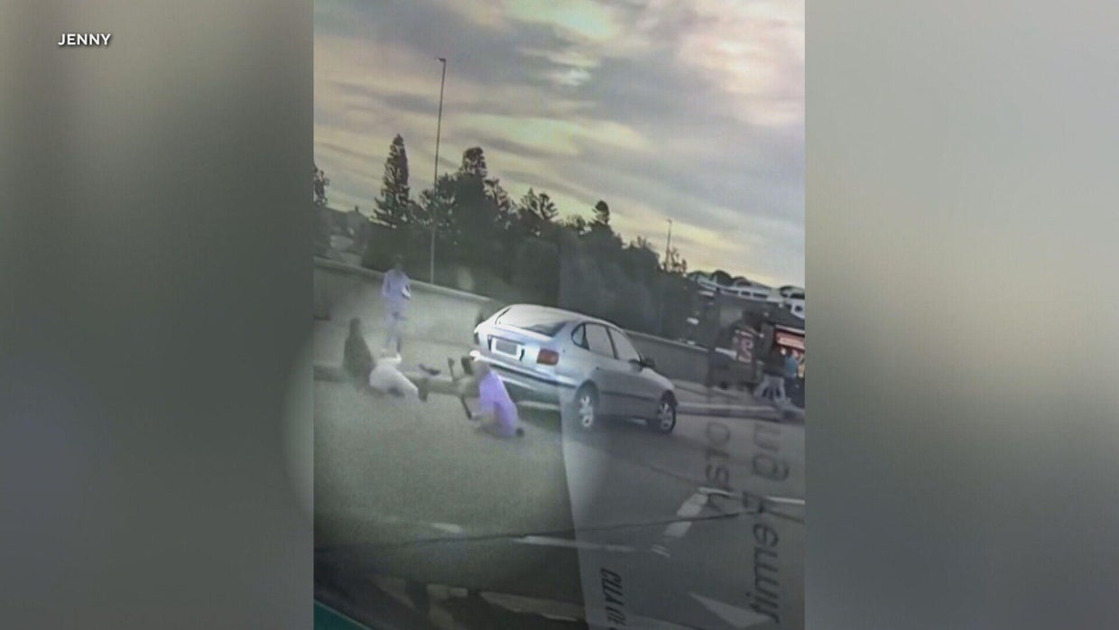 Video shows couple trying to stop Bondi Beach gunmen moments before the