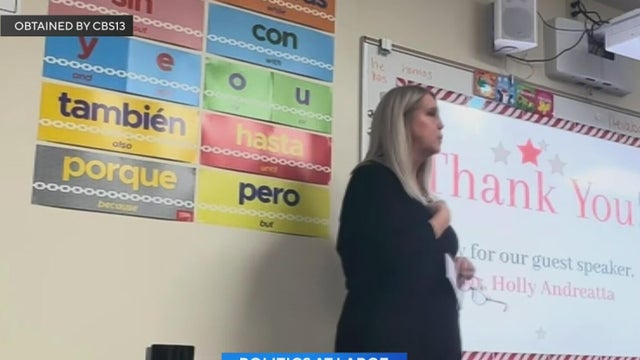 Holly Andreatta speaking at a club meeting inside a school classroom 