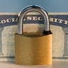 Close up of lock and social security card 