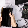 Empty Wallet with Utility Bill and Calculator: Financial Crisis Concept 