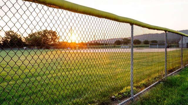 Public Baseball Field, School Sports Field with Chainlink Fence in Rural Small Town America 