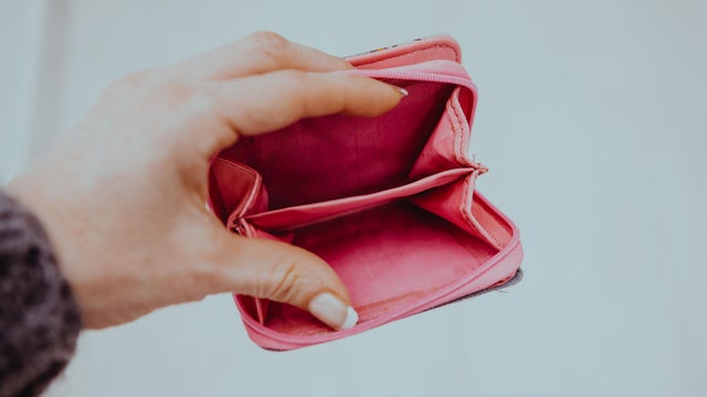 woman hand holding empty wallet 