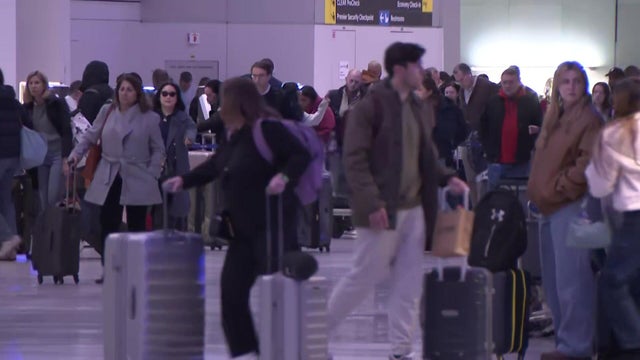 Travelers inside Terminal C at Newark Liberty International Airport 