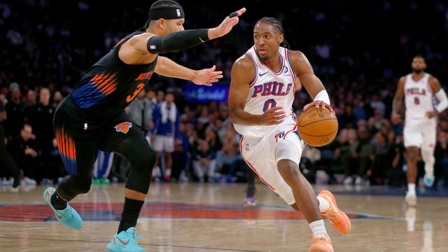 New York Knicks guard Josh Hart, left, defends against Philadelphia 76ers guard Tyrese Maxey, right, during the second half of an NBA basketball game, Friday, Dec. 19, 2025, in New York. 