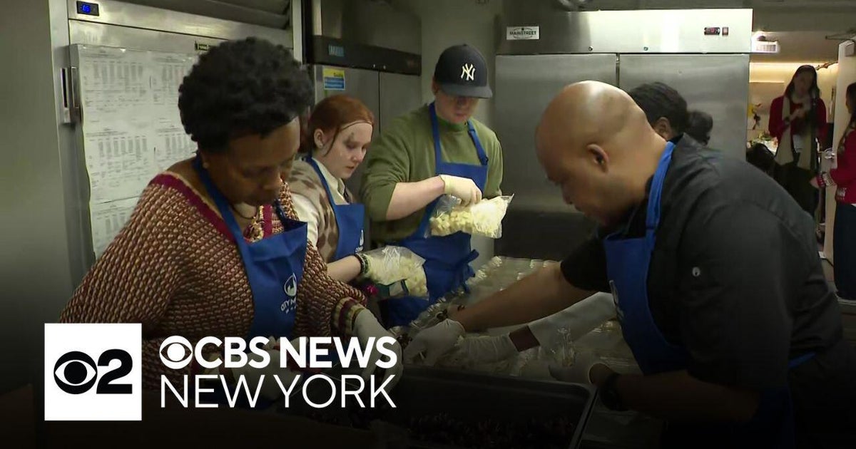Volunteers help pack meals for homebound New Yorkers on Christmas