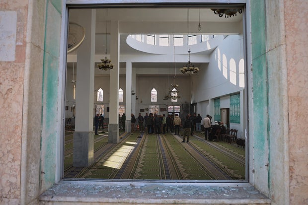 Syrian security forces inspect the damage after an explosion in the Imam Ali bin Abi Talib Mosque in Homs, Syria, Dec. 26, 2025. 