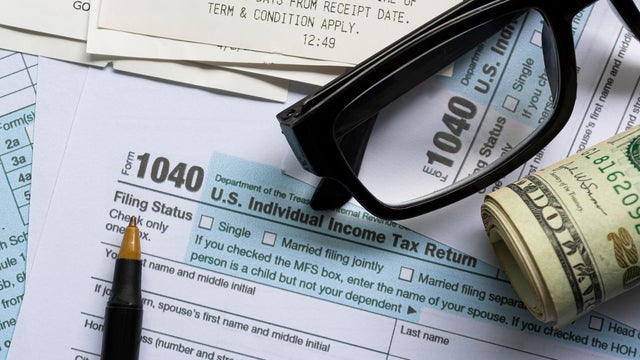 Tax forms 1040. U.S Individual Income Tax Return with other stationeries. 