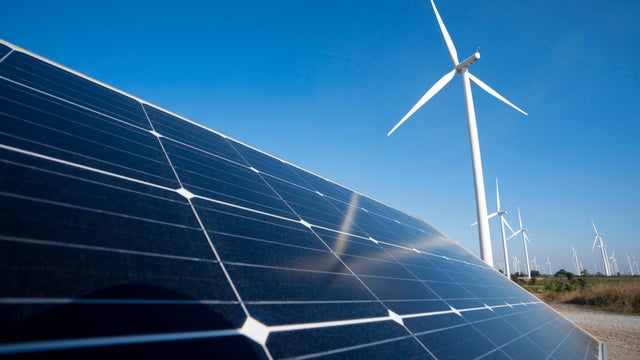 Solar panel and wind turbine farm clean energy. 